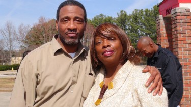 Pastor Howard L. Young poses for the picture with his wife outside of the Affordable Hotel, after service. (C) 3/4/14