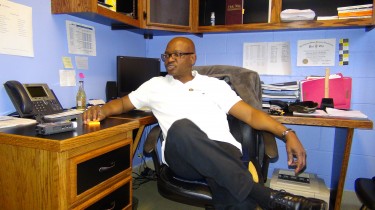 Samuel Oshonaike, Atlanta Mission Social worker, sit at his office desk as he explains his role and with the agency and how the program works. Atlanta Mission (C) 3/9/14