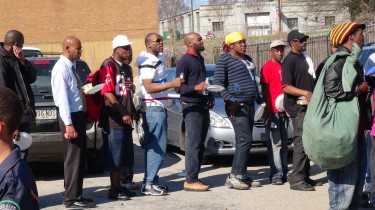 March 4, 2014, the crowd patiently wait in line while  to have their plates field.