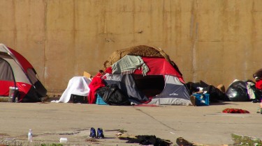 The tent is a make-shift home of a homeless man.  They reside in a large parking lot directly across the street from the Peach & Pine Homeless Shelter in downtown Atlanta. (C)3/9/14